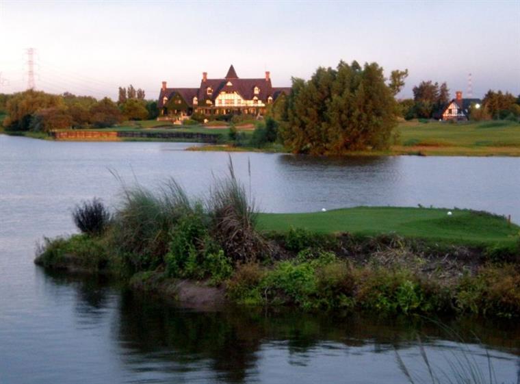 The green guarded by water