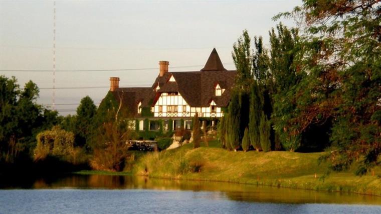 The clubhouse across the water in autumn